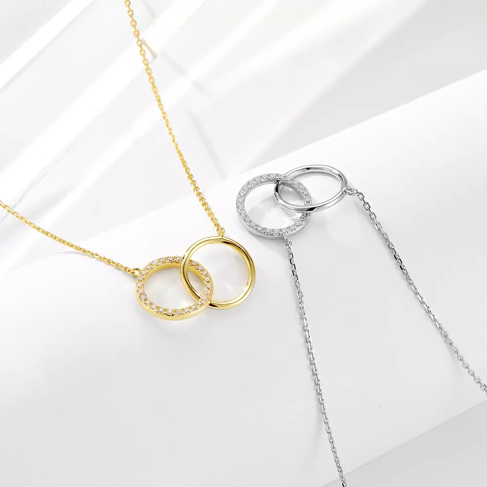 Gold and silver diamond-studded circular double-ring interlocking necklace